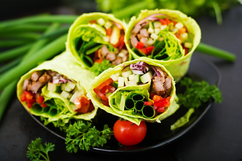 A turkey and veggie wrap filled with greens and lean protein, a tasty pick for the most healthy fast food lifestyle.